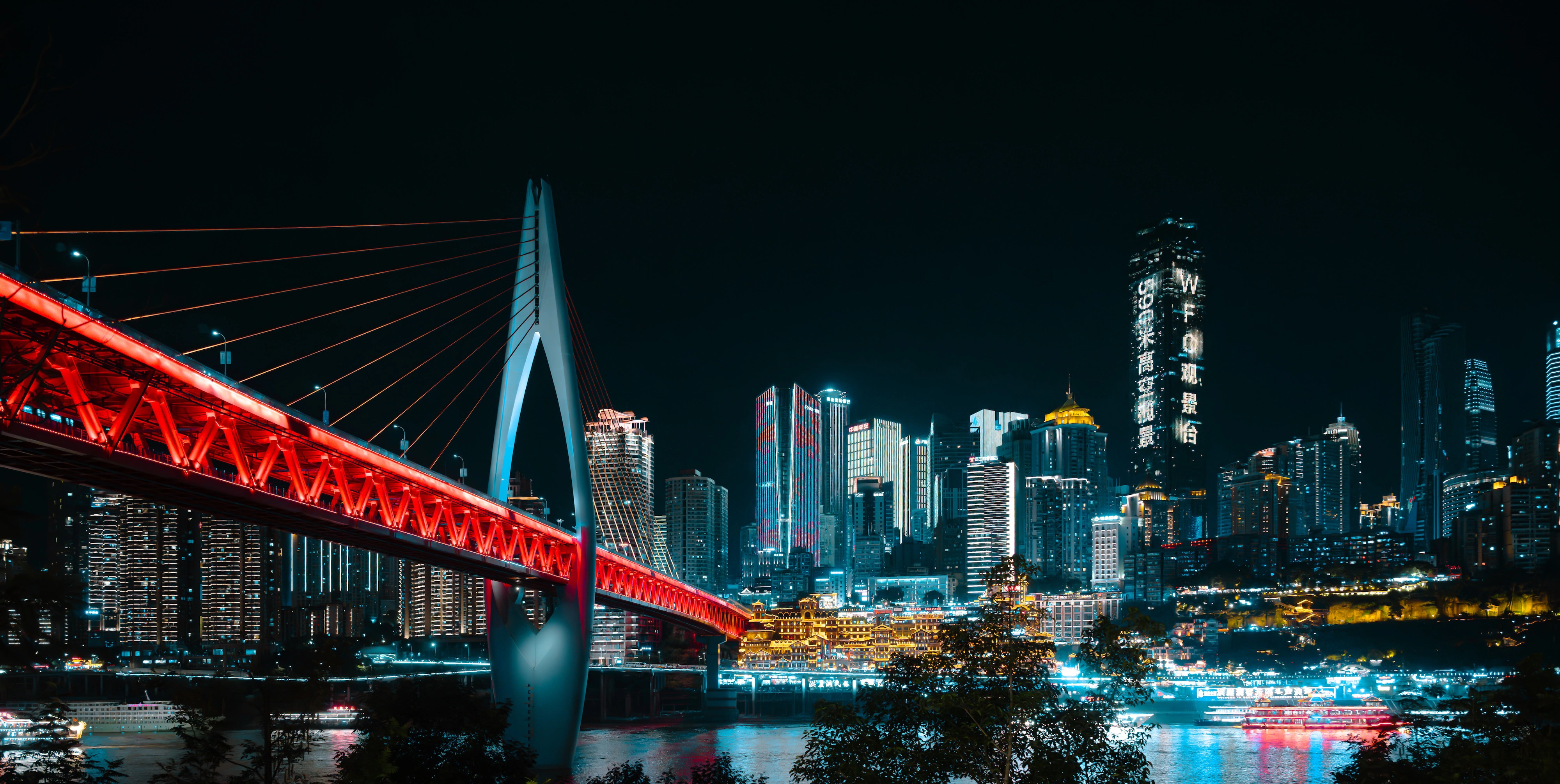 Qiansimen bridge burning red across the night skyline