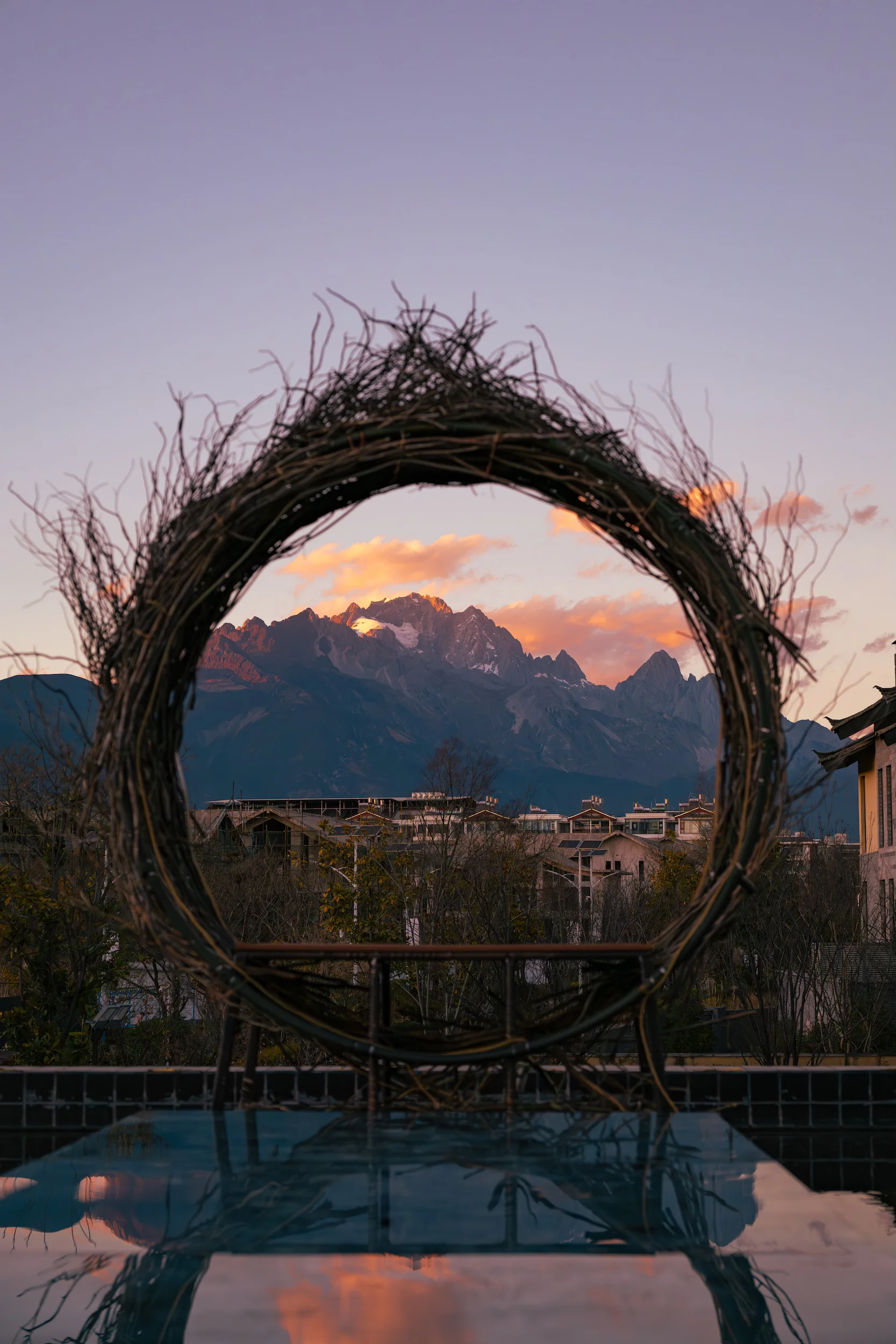 A woven wreath framing the sunset peaks